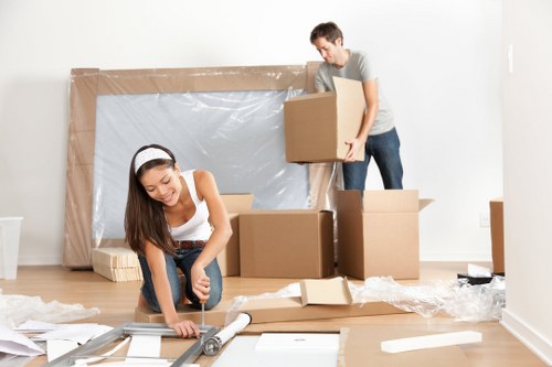 House movers loading furniture on a residential street in Boundsgreen