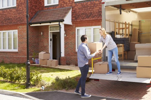 Professional team handling office furniture and equipment during a Boundsgreen office move