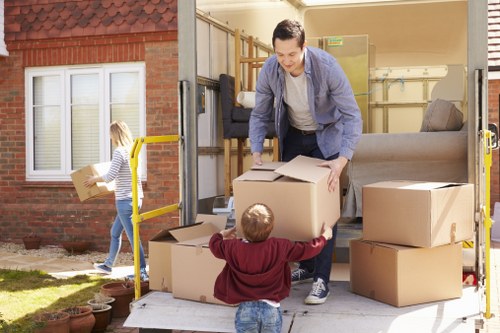 Packed boxes and furniture being loaded for a Boundsgreen relocation