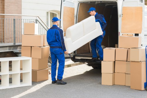 Furniture being loaded carefully into a removal van for a local home move