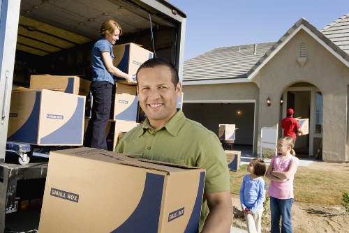 Professional man with van service handling household items in Bounds Green
